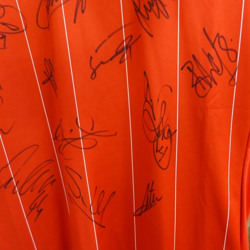 726C - A signed Nottingham Forest shirt containing signatures from seventeen members of the 2018-19 squad i... 