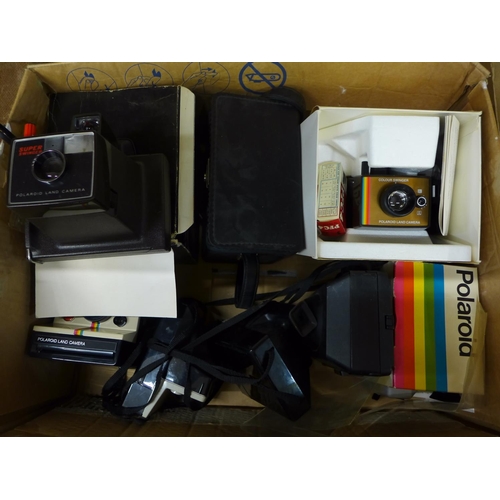 734 - A collection of Polaroid cameras