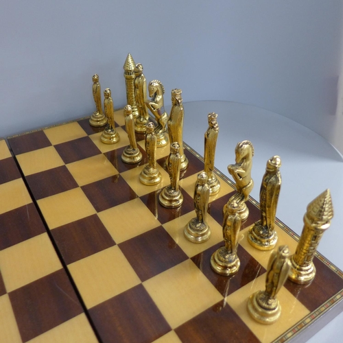 766 - A chess set and board/box, medieval style pieces, one Queen missing