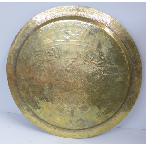 801 - A Persian brass circular tray, 34cm