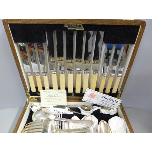 803 - A canteen of Viners Sheffield EPNS spoons and forks, fish knives and forks with ivoreen handles in a... 