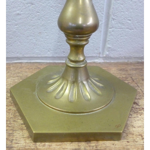 804 - A brass oil lamp with glass reservoir and shade, small chip to the shade, 69cm