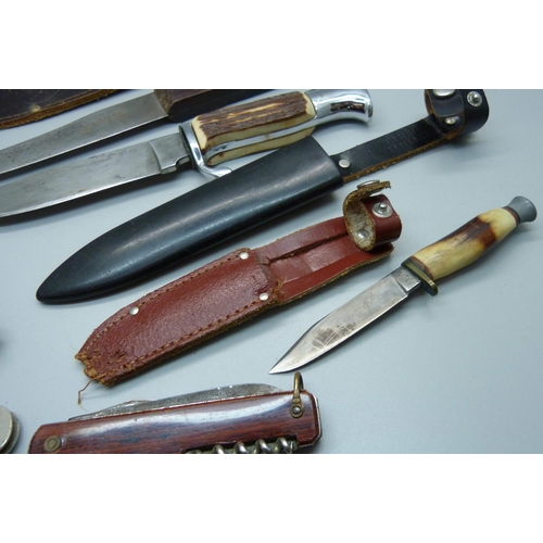 817 - Six knives including a Pradel multi-tool knife, a knife marked Girl Guides, one with Scouts emblem o... 