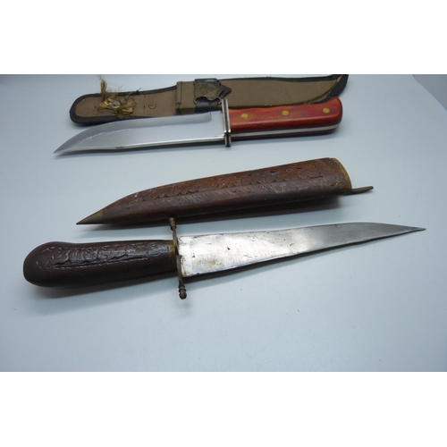 818 - Two knives, one with scabbard marked Eighth Air Force