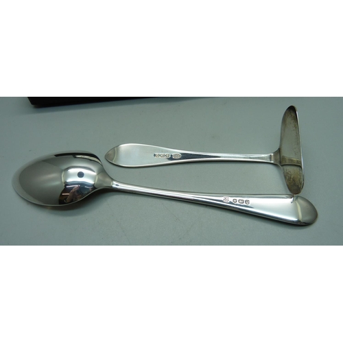 838 - A silver spoon and a silver pusher, 45g