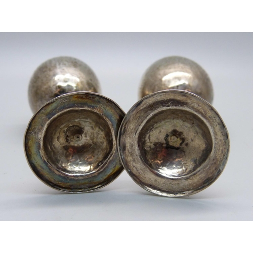 855 - A pair of small hammered 900 silver goblets, 45g