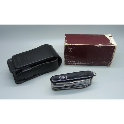 862 - A Victorinox Swiss Army utility knife with leather case