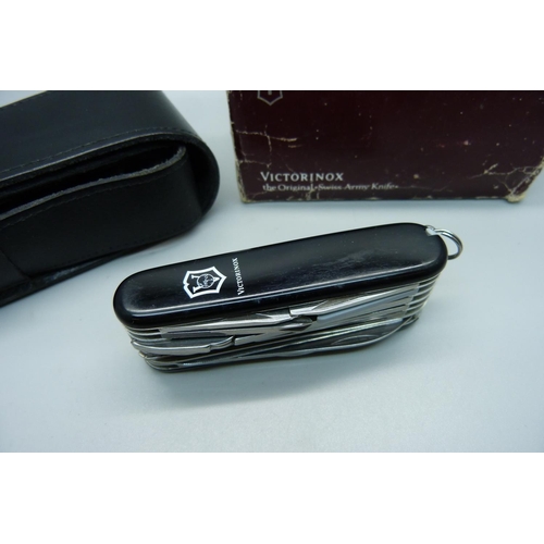 862 - A Victorinox Swiss Army utility knife with leather case