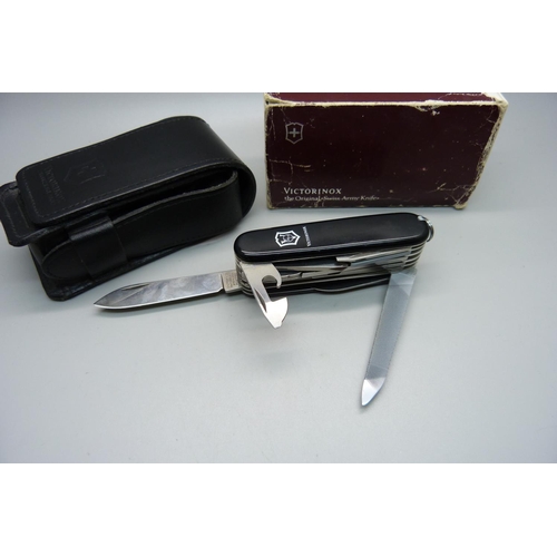 862 - A Victorinox Swiss Army utility knife with leather case