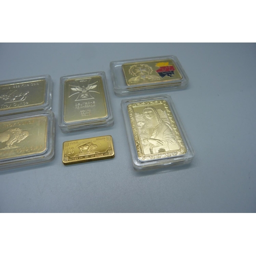 873 - Six 1oz. 999 gold clad bullion bars and one 10g bar