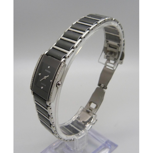 877 - A lady's Rado Jubilee diamond and stainless steel wristwatch with a ceramic strap, boxed