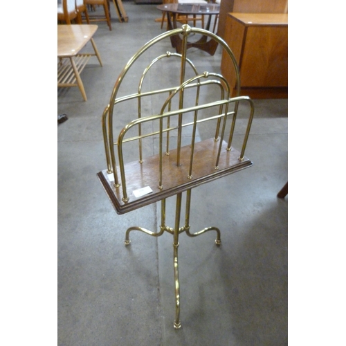 106 - A Victorian oak and brass revolving newspaper stand