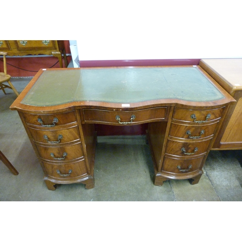 108 - A Regency style mahogany and green leather topped desk