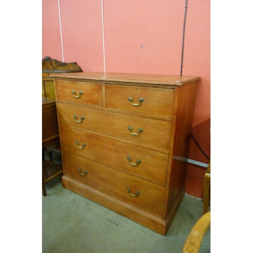 112 - An Edward VII Waring & Gillows oak chest of drawers