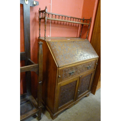 116 - A Victorian Aesthetic Movement carved walnut bureau