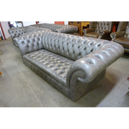 120 - A grey leather Chesterfield settee