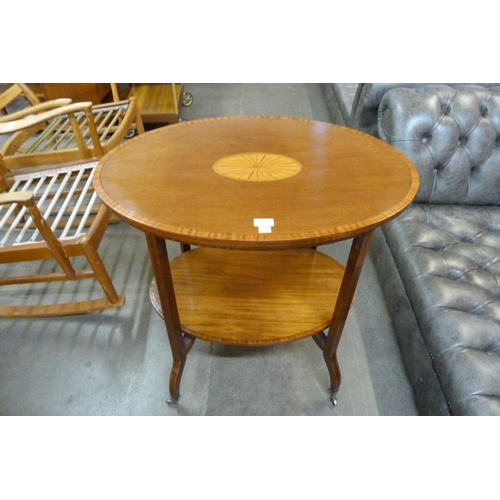 124 - An Edward VII mahogany and satinwood inlaid oval centre table