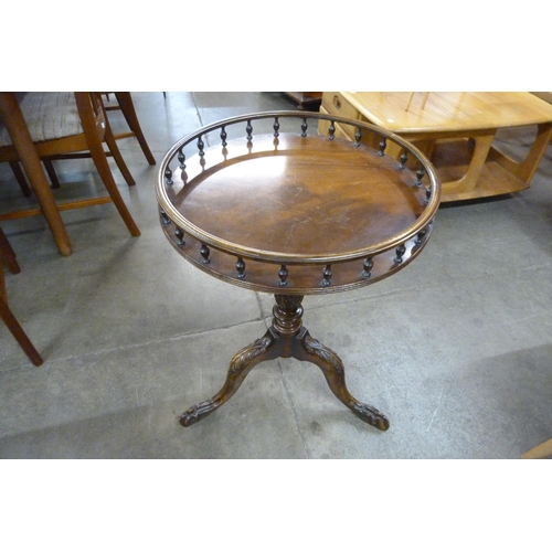 128A - A Chippendale Revival carved mahogany tripod wine table