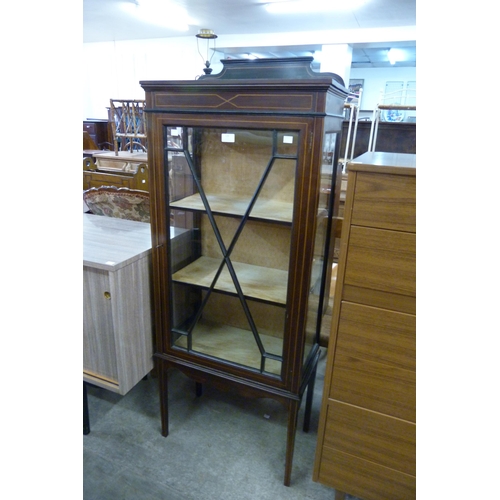 129 - An Edward VII inlaid mahogany single door display cabinet