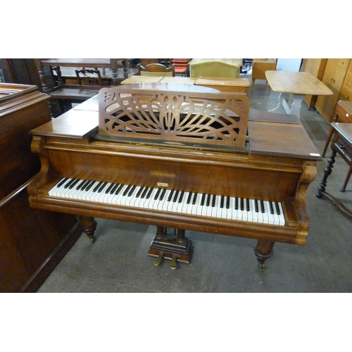 141 - An early 20th Century Beulhoff walnut Baby Grand piano. This lot is sold with non-transferable stand... 