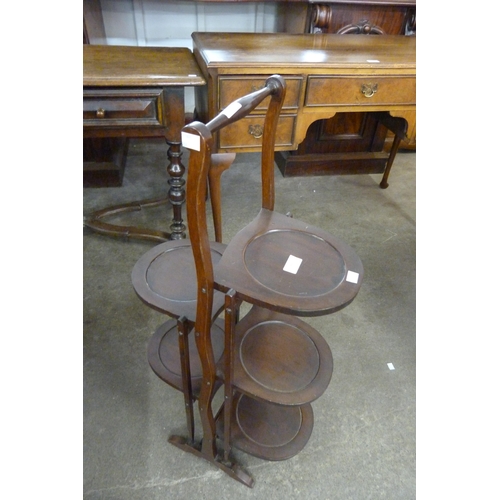 144 - An early 20th Century mahogany folding cake stand