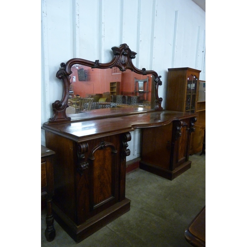 145 - A Victorian mahogany mirrorback pedestal sideboard