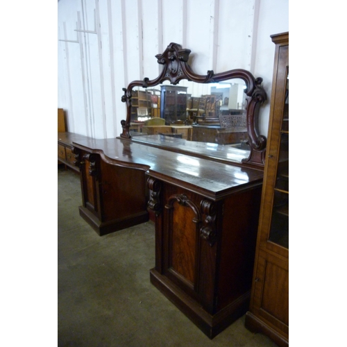 145 - A Victorian mahogany mirrorback pedestal sideboard