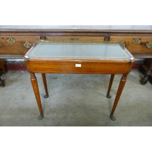 146 - A George IV mahogany and green leather topped writing table