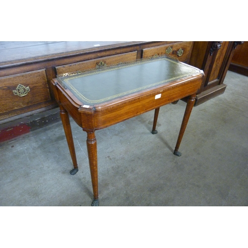 146 - A George IV mahogany and green leather topped writing table