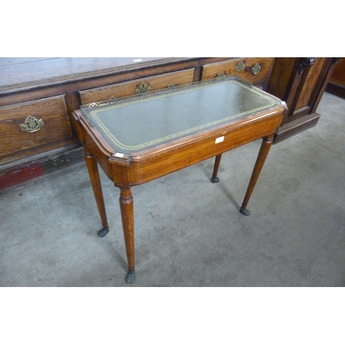 146 - A George IV mahogany and green leather topped writing table