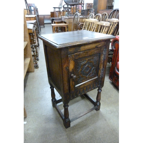 155 - A small 17th Century style carved oak cabinet