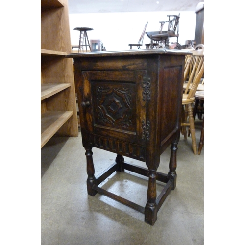 155 - A small 17th Century style carved oak cabinet