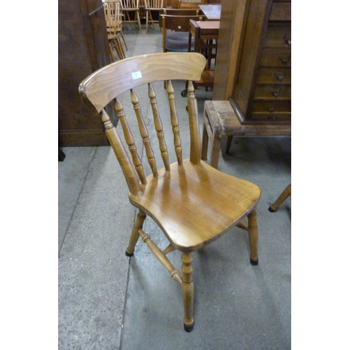 159 - A set of four Victorian beech kitchen chairs