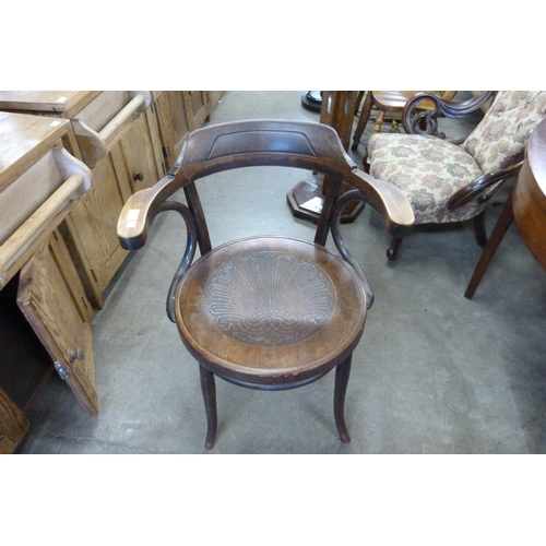 166 - An early 20th Century beech bentwood elbow chair