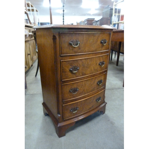 169 - A small burr walnut bow front chest of drawers