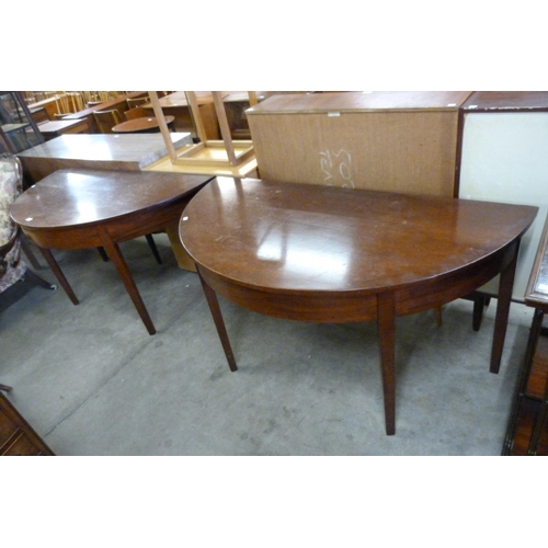 171 - A pair of George IV mahogany demi-lune console tables