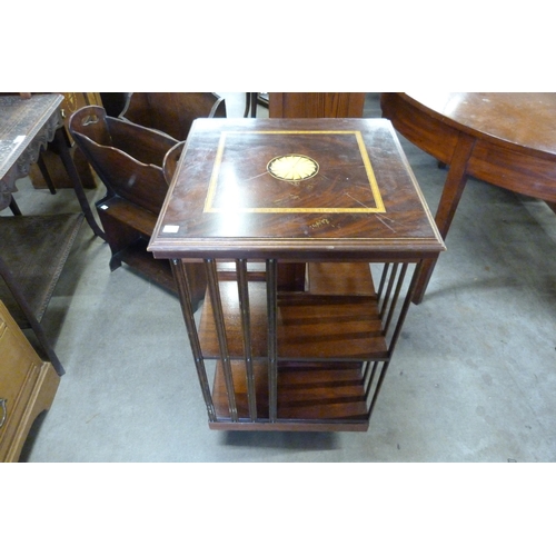 173 - A Regency style inlaid mahogany revolving bookcase