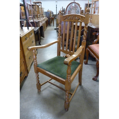 176 - An oak barleytwist elbow chair