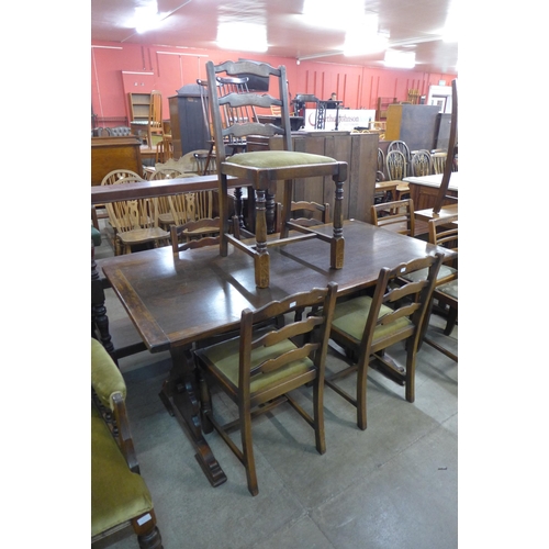 215 - An oak refectory table and five chairs