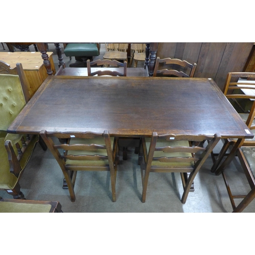 215 - An oak refectory table and five chairs