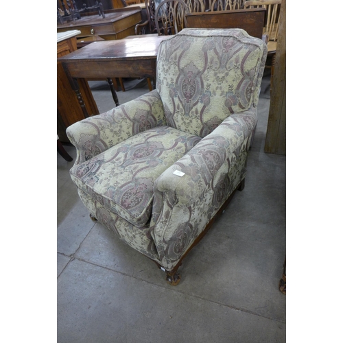 218 - A pair of early 20th Century Chippendale Revival carved mahogany and fabric upholstered armchairs