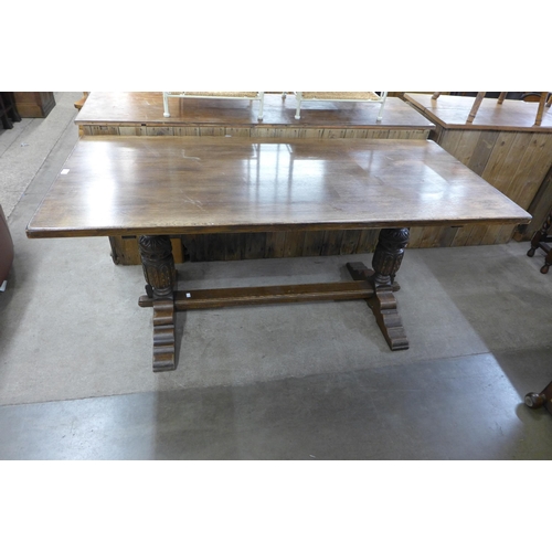 221 - A 17th Century style carved oak refectory table