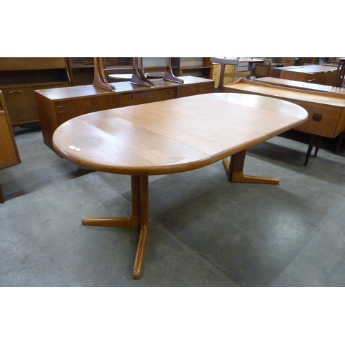 27 - A Danish teak extending dining table