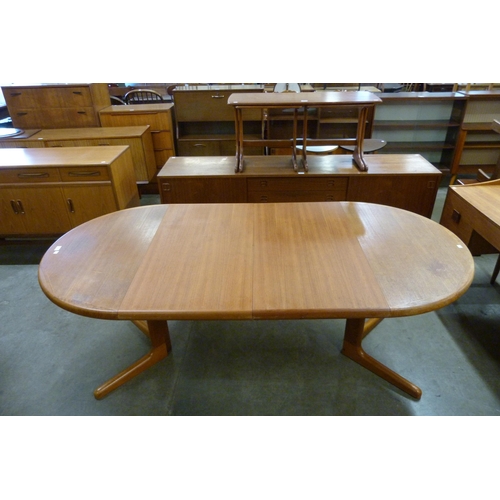 27 - A Danish teak extending dining table