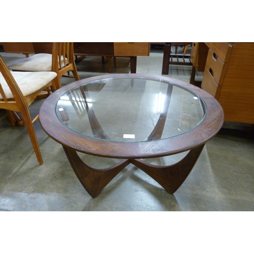 31 - A G-Plan Astro teak and glass topped circular coffee table