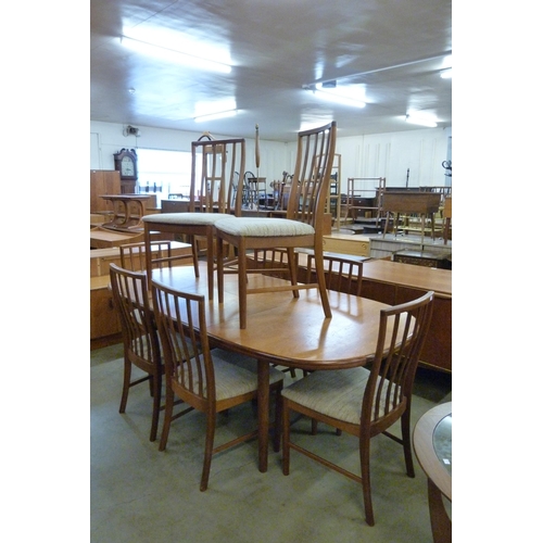 35 - A McIntosh teak extending dining table and eight chairs