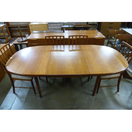 35 - A McIntosh teak extending dining table and eight chairs