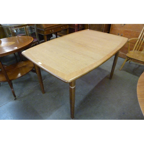 50 - A Meredew teak extending dining table