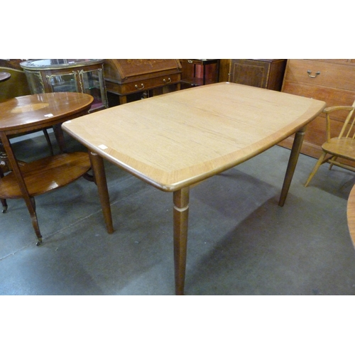 50 - A Meredew teak extending dining table