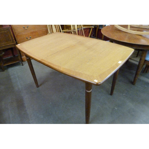 50 - A Meredew teak extending dining table